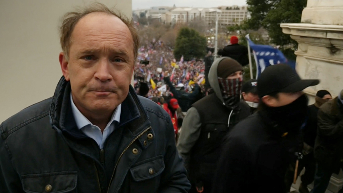 ITN’s Robert Moore during the assault on the Capitol (Credit: ITV)