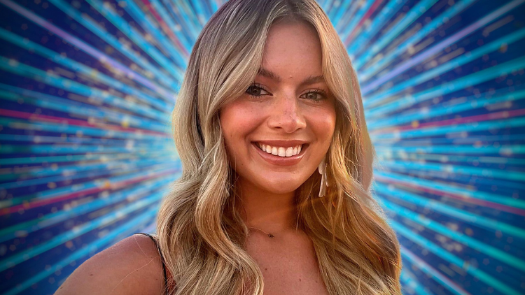 A photo of Tasha Ghouri smiling in front of a sparkly blue backdrop