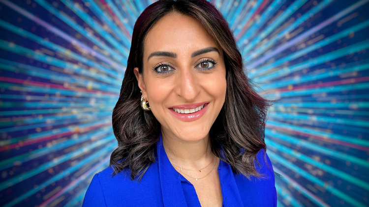 A photo of Punam Krishan in front of a glittery blue backdrop