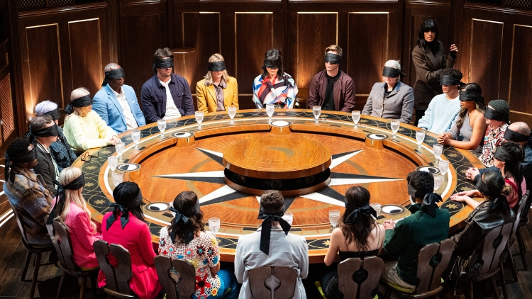 Claudia Winkleman circles the contestants of The Traitors at the Round Table as she chooses the three Traitors