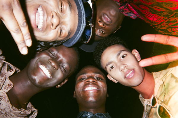 Cast of Grime Kids looking down at the camera