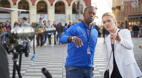 Adrian Lester with Julia Stiles on the set of Riviera (Credit: Sky)