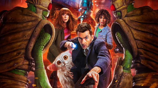 The Doctor, played by David Tennant, looks into the camera, with Donna Noble and Rose Noble stood behind him. The white, fluffy alien Beep the Meep clutches the Dcotor's jacket. They are flanked on either side by two insectoid Wrarth Warriors  