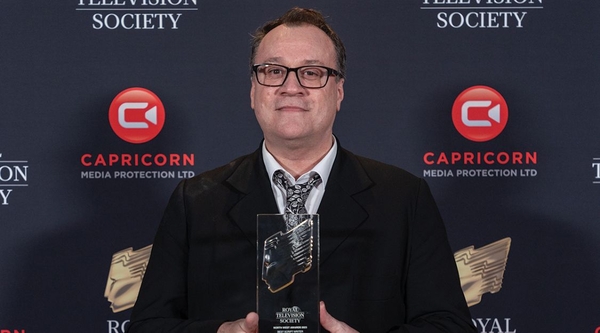 Russell T Davies holds an RTS award