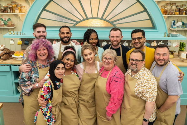 Twelve bakers gather round in the Bake Off tent 