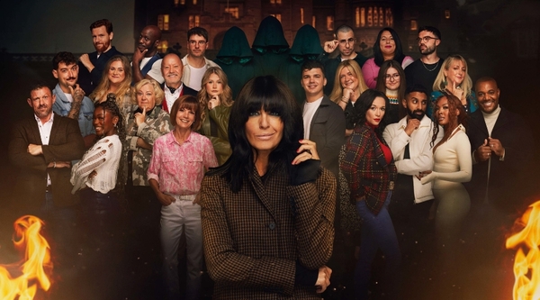 Claudia Winkleman stands in front of the cast of The Traitors series two, who stand in front of a gloomy Scottish castle