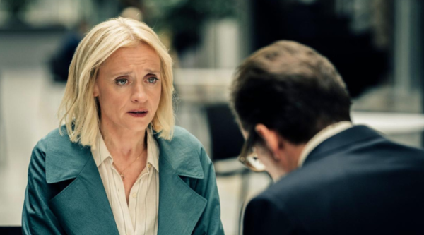 Anne-Marie Duff, looking slightly distraught, talks to Ben Miller, who is out of focus with his back is to the camera