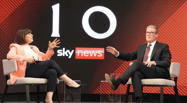 Beth Rigby talks to Keir Starmer in front of a graphic for Sky News, below a large picture of the number 10, the same on the door of 10 Downing Street