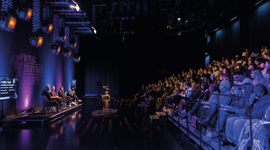 A crowd of people in front of a panel, being held in Dock10 Studios MediaCity UK