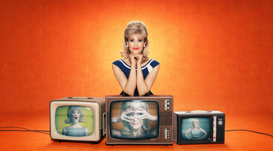 Sophie Straw sits with her arms on top of three TVs from the 1960s, each with a different image of her