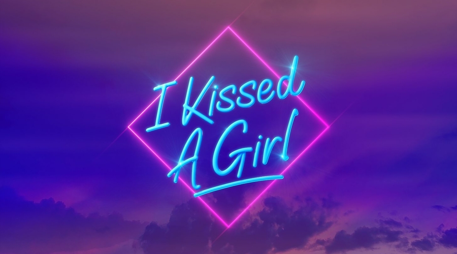 I kissed a girl is written in neon pink writing over a purple background