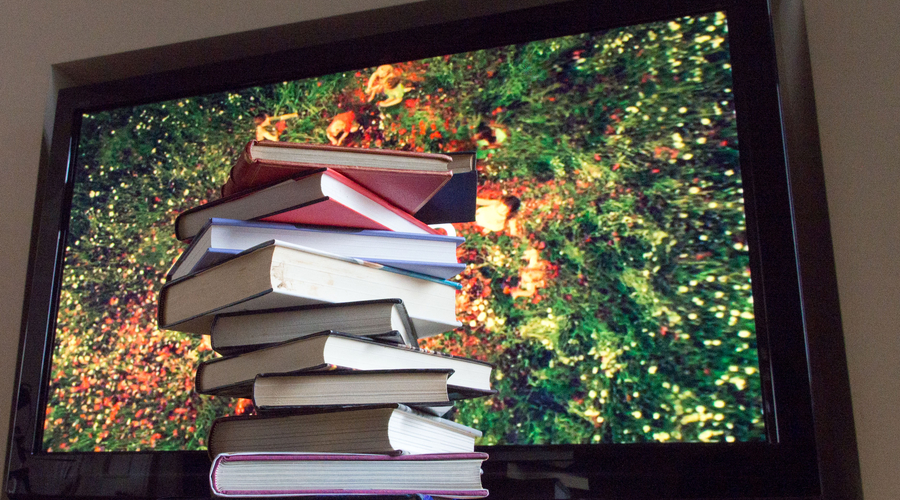 books in front of tv image