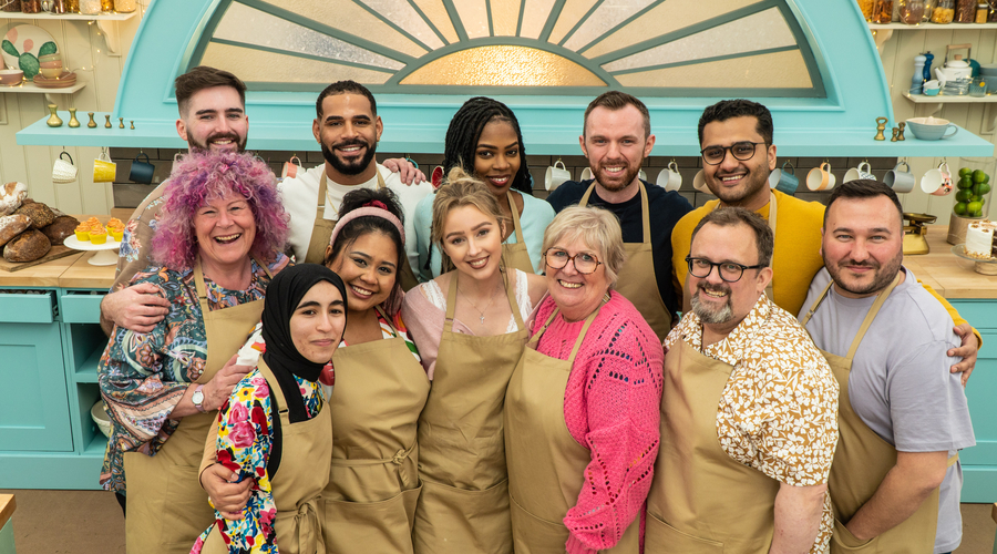 Twelve bakers gather round in the Bake Off tent 