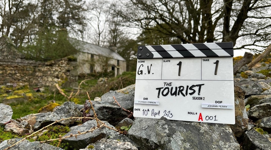 a clapper board stating "The Tourist" in the irish countryside