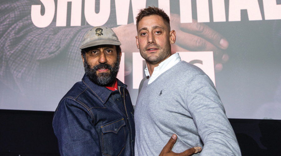 Adeel Akhtar and Michael Socha pose together, the former smiling slightly and the latter not smiling