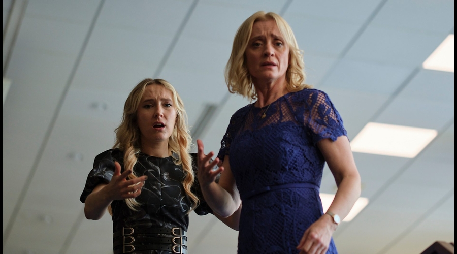 Rose Ayling-Ellis and Anne-Marie Duff stand in an office, gesturing at something off-screen, looking concerned