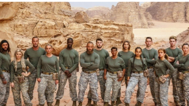 fourteen celebrities in camouflage stand in the Jordanian desert 