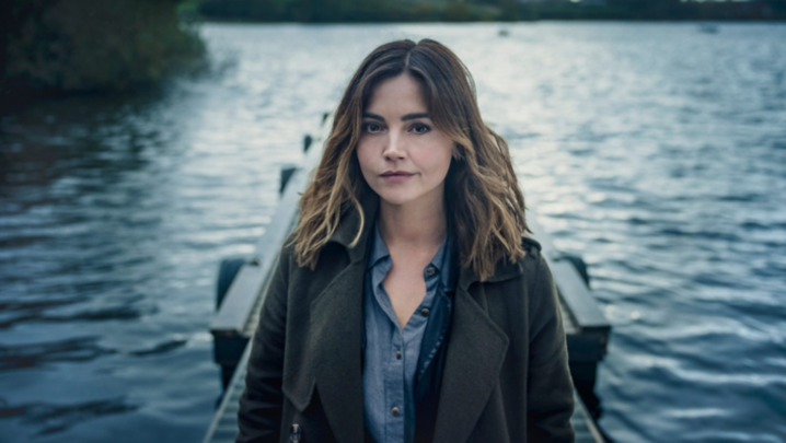 Jenna Coleman, in character as Ember Manning, looks into the camera at the foot of a jetty