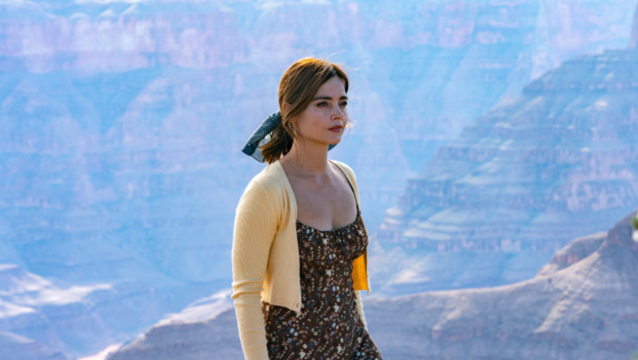 Jenna Coleman stands in front of a canyon