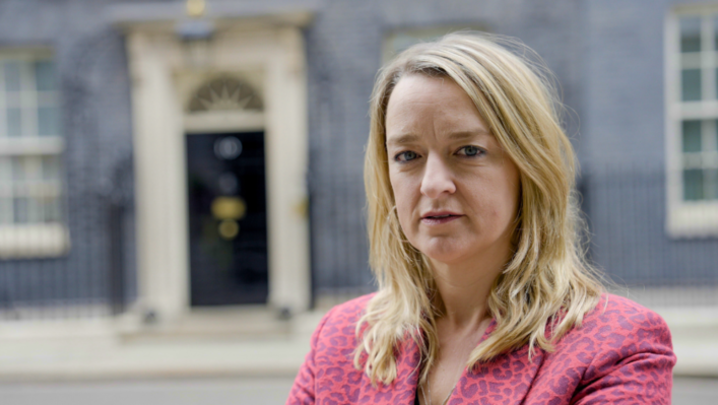 Laura Kuenssberg stands in front of 10 Downing Street, looking into the camera