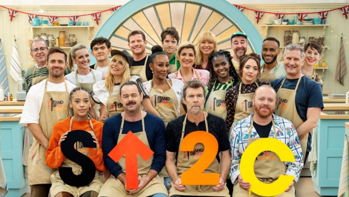 The celebs taking part in The Great Celebrity Bake Off for SU2C line up in the tent in three rows 
