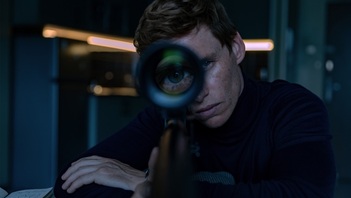 Eddie Redmayne stares down the sight of a sniper as the titular assassin in The Day of the Jackal