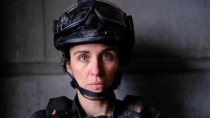 Vicky McClure looks into the camera, wearing a bomb disposal operative outfit