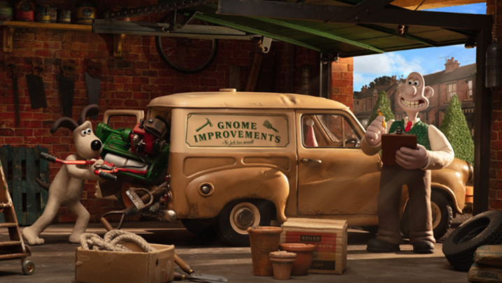 Gromit packs a van with "GNOME IMPROVEMENTS" written on it, with Wallace standing by with a clipboard, smiling