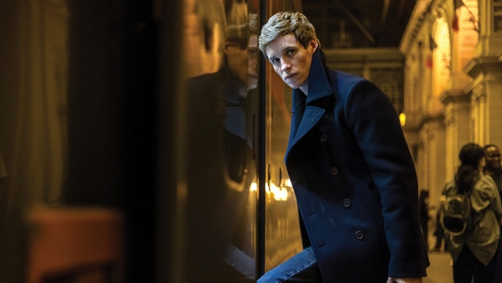 Eddie Redmayne steps onto a train as the titular assassin of The Day of the Jackal