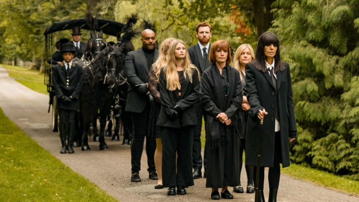Claudia Winkleman leading the funeral procession in The Traitors