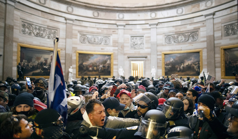 Trump supporters fighting police inside the US Capitol on 6 January 2021 (Credit: Anadolu Agency/Getty Images)
