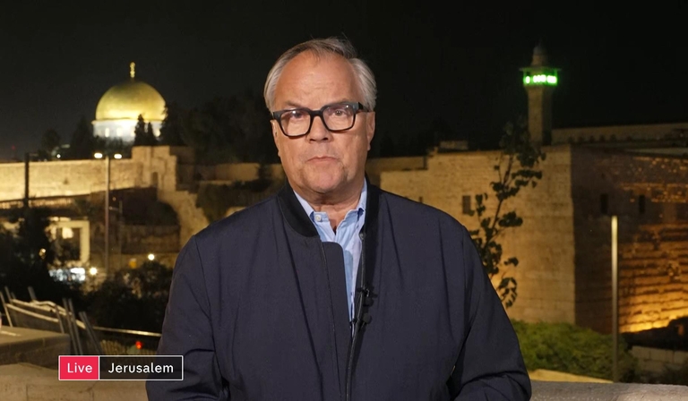 Matt Frei stands outside, delivering a news piece to camera. The two parts of the chyron read 'Live' and 'Jerusalem'