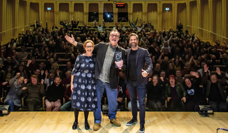 Russell T Davies with Gethin Jones (right) and Judith Winnan (left), who presented him with his RTS Fellowship (Credit: Aaron Lowe Photography)